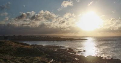 The coastline at Broadsea in Fraserburgh, sun is setting